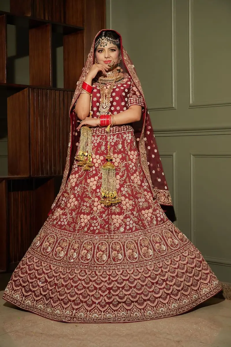 Bride twirling in an embroidered lehenga